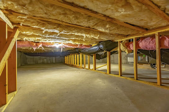 Installed underfloor insulation sheets. Wilton Insulation